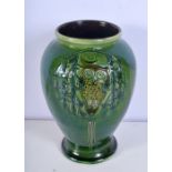 A Liberty of London green glazed owl vase signed by Frederick Braddon 20cm.