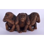 AN EARLY 20TH CENTURY JAPANESE TAISHO PERIOD CARVED WOOD OKIMONO modelled as the three wise monkeys.