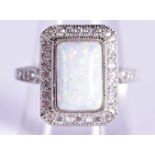 A SILVER, OPAL AND MARCASITE RING. Size P, stamped 925, weight 7.7g