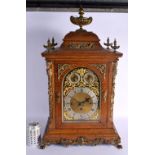 A LARGE ANTIQUE BRONZE MOUNTED OAK MANTEL CLOCK retailed by Harris & Shafer, decorated with mask hea