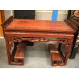 AN EARLY 20TH CENTURY CHINESE CARVED HARDWOOD TABLE. 65 cm x 95 cm x 46 cm.