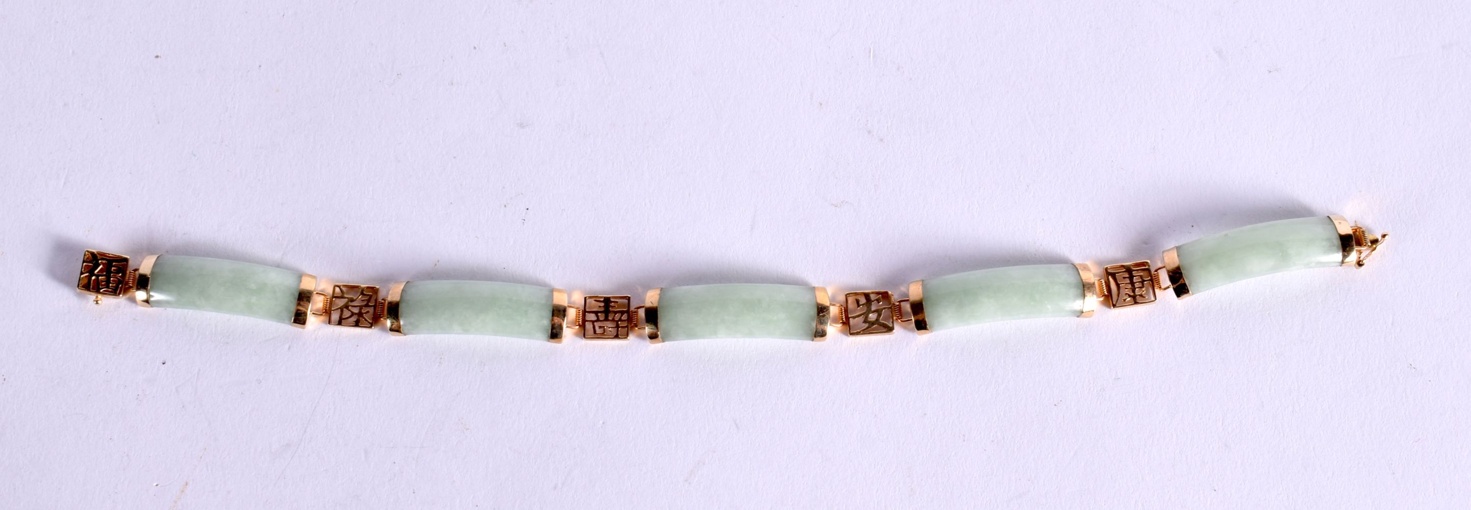 A 9CT GOLF AND JADE BRACELET. 19cm long, Stamped 9K, weight 11.3g