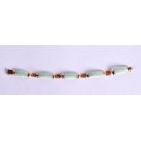 A 9CT GOLF AND JADE BRACELET. 19cm long, Stamped 9K, weight 11.3g