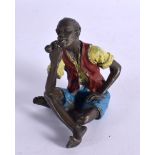 A COLD PAINTED BRONZE OF AN ARAB SMOKING A PIPE. 5.7cm x 5.6cm x 4cm, weight 183g