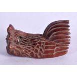 A CARVED WOOD CHICKEN. 2.6cm x 5.2cm x 2.7cm