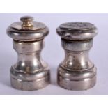 A PAIR OF STERLING SILVER CONDIMENTS. Stamped Sterling, 6cm high