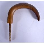 A 19TH CENTURY MIDDLE EASTERN CARVED RHINOCEROS HORN HANDLE. 14 cm x 12 cm.