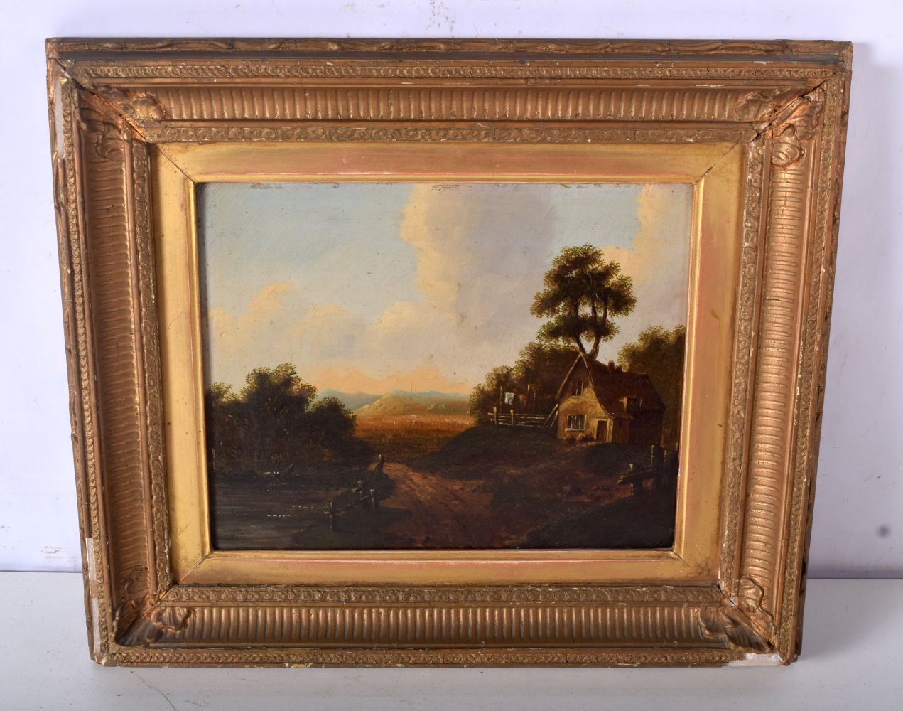 By Charles Morris a framed oil on board of a rural scene 19 x 25 cm.