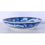 A Chinese porcelain blue and white dish decorated with a dragon 4 x 20cm.