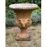A VERY LARGE COUNTRY HOUSE TERRACOTTA PEDESTAL GARDEN URN decorated with rams heads. 94 cm x 72 cm.