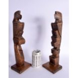 A LARGE PAIR OF NORTH AMERICAN CORMORANT ISLAND ALERT BAY HAIDA FIGURES modelled upon a rectangular