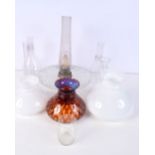 A collection of glass oil lamp bulbs and lamp shades (10).