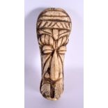 A RARE 19TH CENTURY AFRICAN CARVED BONE TRIBAL MASK HEAD formed as a male. 15 cm x 6 cm.