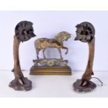 A pair of deer's foot wall sconces together with a brass fire grate front in the shape of a horse 43