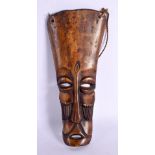 AN EARLY 20TH CENTURY AFRICAN CARVED BONE TRIBAL MASK. 25 cm x 10 cm.