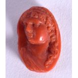 A MINIATURE CORAL CARVING OF A CLASSICAL MALE. 2.4cm x 1.6cm, weight 3.8g
