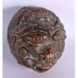 A 17TH/18TH CENTURY INDIAN COPPER ALLOY BUDDHISTIC MASK HEAD. 7.5 cm wide.