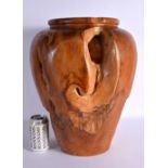 A LARGE VINTAGE CARVED HARDWOOD OPEN WORK ROTTED STYLE VASE. 44 cm x 22 cm.