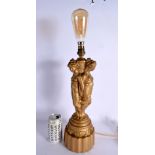 A VINTAGE CONTINENTAL LACQUERED TRIPLE FEMALE LAMP. 54 cm high.