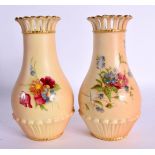 Royal Worcester pair of pierced neck vases shape G1061 painted with flowers on a blush ivory ground