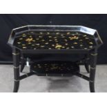 An antique papier mache Japanned gilt tray table 76 x 60 x 47 cm.