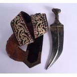 AN ANTIQUE MIDDLE EASTERN CARVED RHINOCEROS HORN OMANI JAMBIYA DAGGER with wire work mounts. Dagger