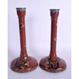 A LARGE PAIR OF EARLY 20TH CENTURY CHINESE CLOISONNE ENAMEL CANDLESTICKS decorated with dragons. 26