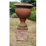 A VERY LARGE COUNTRY HOUSE TERRACOTTA PEDESTAL GARDEN URN ON STAND. 116 cm x 60 cm.