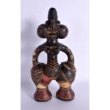 AN UNUSUAL EARLY 20TH CENTURY AFRICAN CARVED AND PAINTED TERRACOTTA FIGURE modelled as a female with