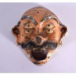 A VINTAGE PAINTED IRON MASK BOTTLE OPENER. 8.25 cm wide.