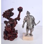 A white-metal model of a Japanese Samurai warrior together with a Chinese model of a dragon. Largest