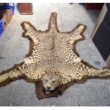 A Leopard skin wall hanging 235 x 180 cm.