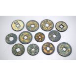 A collection of Chinese metal tokens (12).