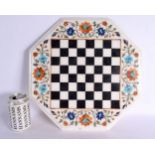 AN INDIAN AGRA MIXED HARDSTONE MARBLE CHESS BOARD decorated all over with foliage. 36 cm wide.