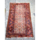 A red ground Caucasian rug 179 x 100 cm
