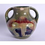 A MOORCROFT "CLAREMONT" POTTERY VASE c1920, with twin handles and decoration of mushroom, marked to