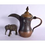 A MIDDLE EASTERN OMANI TYPE BRASS EWER together with an Indian bronze elephant. Largest 25 cm x 18 c