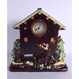 AN UNUSUAL TREACLE GLAZED POTTERY STAG CLOCK. 29 cm x 22 cm.