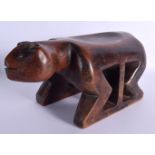 AN UNUSUAL TRIBAL CARVED WOOD ZOOMORPHIC TYPE ANIMAL HEADREST modelled upon all fours. 32 cm x 15 cm