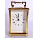 A BRASS CARRIAGE CLOCK. 18 cm high inc handle.