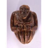 A 19TH CENTURY FRENCH CARVED COQUILLA NUT SNUFF BOX formed as a male holding two dogs. 7.5 cm x 5.5