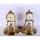 A pair of brass, enamel faced, domed mantel clocks. 30cm.
