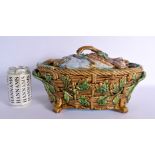 A 19TH CENURY MINTON MAJOLICA GAME PIE DISH with overlapping dead game on a bed of leaves, the lower