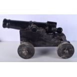 A vintage wood and Iron model cannon 27 x 55 cm.