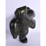 A CHARMING NORTH AMERICAN INUIT CARVED STONE FIGURE OF A MALE modelled with a seal upon his back. 18