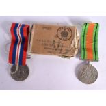 A 1939 WAR MEDAL AND A DEFENCE MEDAL ISSUED TO MR SS PLOWMAN (2)