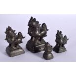 FOUR ANTIQUE INDIAN BRONZE OPIUM WEIGHTS. (4)