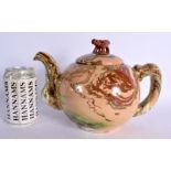 A LARGE EARLY 19TH CENTURY BRITISH AGATE WARE TEAPOT AND COVER of naturalistic form. 24 cm x 18 cm.