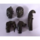 FIVE CONTEMPORARY BRONZE WALKING CANE HANDLES. Largest 8 cm long. (5)