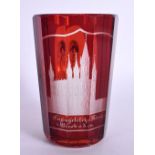 AN ANTIQUE GERMAN RUBY BOHEMIAN GLASS MUG engraved with buildings. 11.5 cm high.